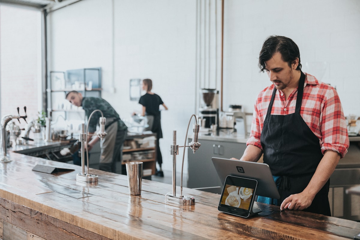 Small business owner working in a warm shop setting