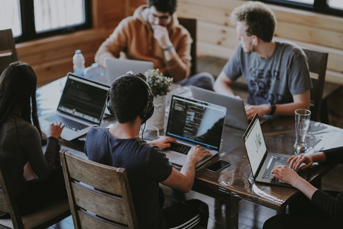 A diverse team meeting that includes a colleague using a wheelchair